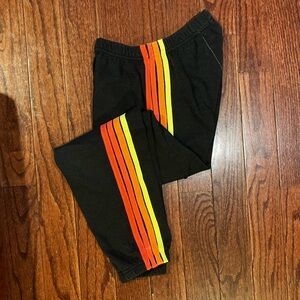 Aviator Nation Black Track Pants with Orange & Yellow Side Stripes